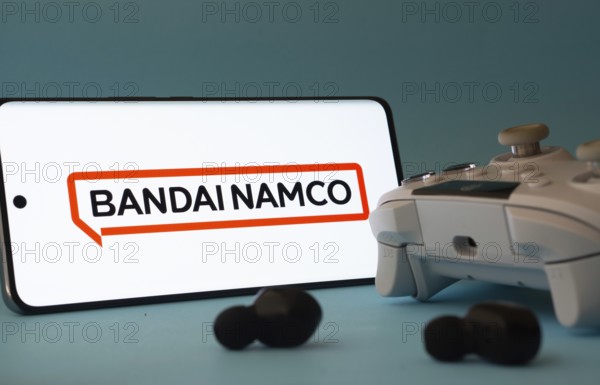 Dhaka, Bangladesh- 23 Mar 2025: A smartphone with a Bandai Namco Entertainment icon next to a