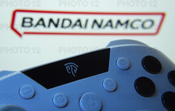 Dhaka, Bangladesh- 24 Mar 2025: A close-up of a gamepad with the Bandai Namco Entertainment seen on