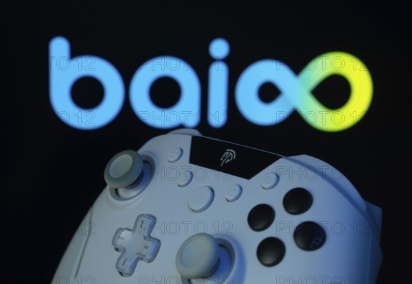 Dhaka, Bangladesh- 20 Mar 2025: A close-up of a gamepad with the Baioo Family Interactive Ltd seen