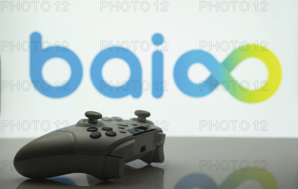 Dhaka, Bangladesh- 20 Mar 2025: A close-up of a white gamepad with the Baioo Family Interactive Ltd