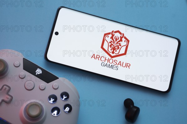 Dhaka, Bangladesh- 22 March 2025: Archosaur Games logo displayed on a smartphone surrounded by