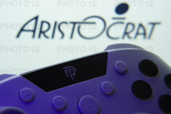 Dhaka, Bangladesh- 24 Mar 2025: A close-up of a gamepad with the Aristocrat seen on screen in the