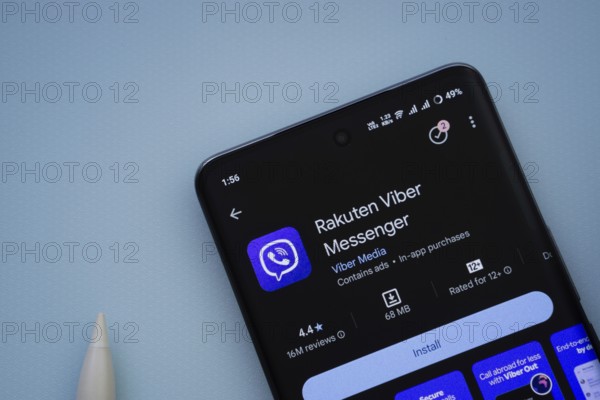 Dhaka, Bangladesh- 29 May 2025: On a blue surface, a smartphone displays the Rakuten Viber app