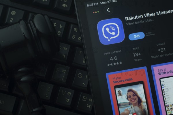 Dhaka, Bangladesh- 28 Oct 2025: An iPad displaying the Rakuten Viber app against a judge's gavel