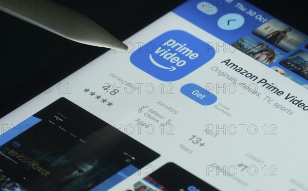 Dhaka, Bangladesh- 30 Oct 2025: Amazon Prime Video app on a iPad screen with a pen pointing at the