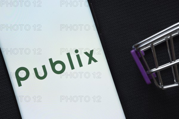 Dhaka, Bangladesh- 03 July 2025: A smartphone displaying the Publix logo next to a miniature