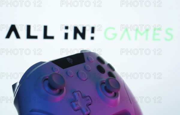 Dhaka, Bangladesh- 20 Mar 2025: A close-up of a gamepad with the All in! Games seen on screen in