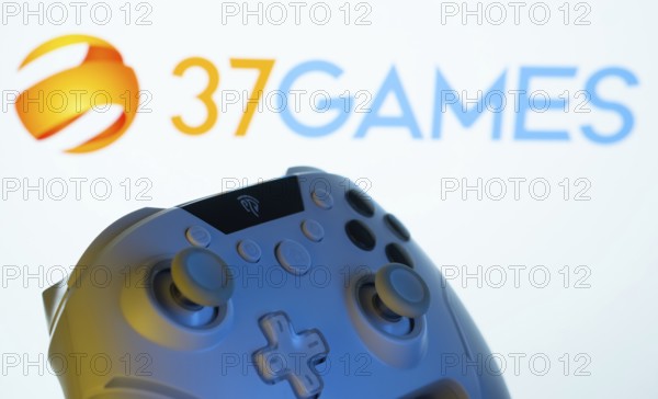 Dhaka, Bangladesh- 20 Mar 2025: A close-up of a gamepad with the 37Games seen on screen in the