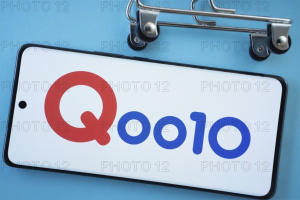 Dhaka, Bangladesh- 03 July 2025: Smartphone screen showing the Qoo10 logo with shopping cart wheels