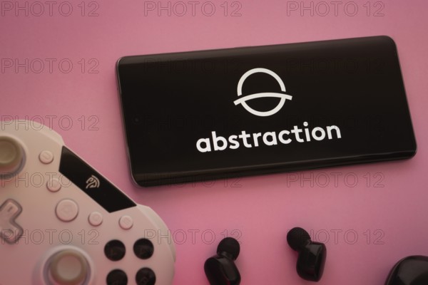 Dhaka, Bangladesh- 08 Apr 2025: A smartphone displaying the Abstraction logo next to a gaming