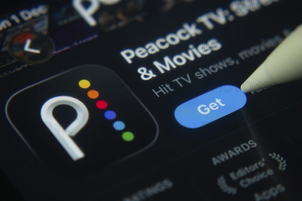 Dhaka, Bangladesh- 01 Dec 2025: A close-up of the Peacock TV app icon in the App Store on an iPad
