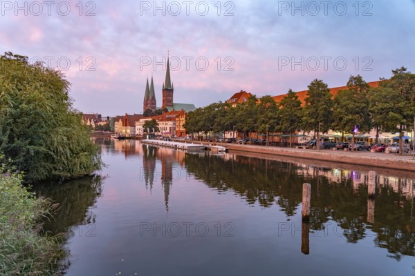 Old town with St. Mary's Church and St. Peter's Church and the Trave at dusk, Lübeck,