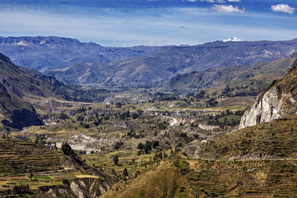 Mountainous landscape with green valleys and blue sky, The landscape of Colca Canyon in the Aden of