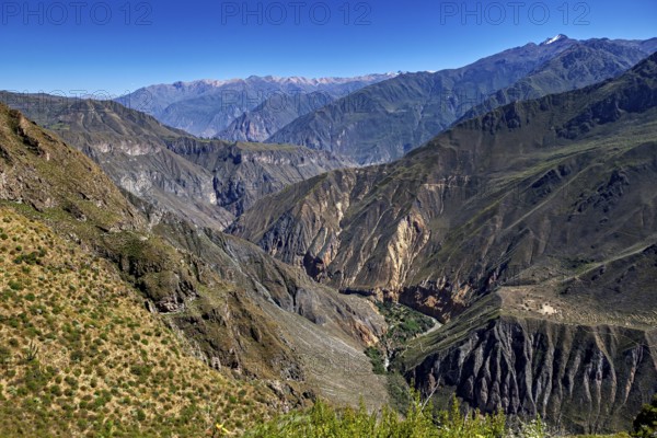 Wide views of majestic mountains and a deep, impressive gorge, The landscape of Colca Canyon in the
