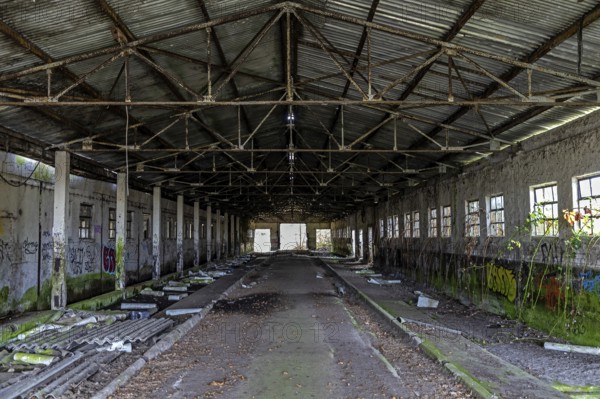 Abandoned hall with Grafity, dilapidated plant of a former agricultural production cooperative of