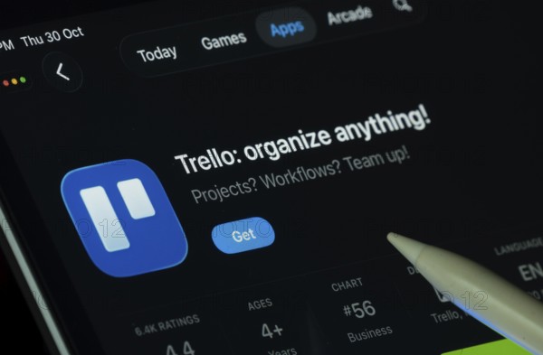 Dhaka, Bangladesh- 30 Oct 2025: Trello app displayed on a iPad screen in dark mode with a digital