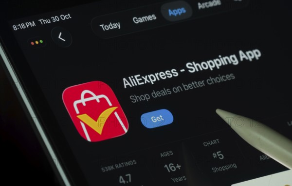 Dhaka, Bangladesh- 21 Nov 2025: AliExpress app displayed on a iPad screen in dark mode with a