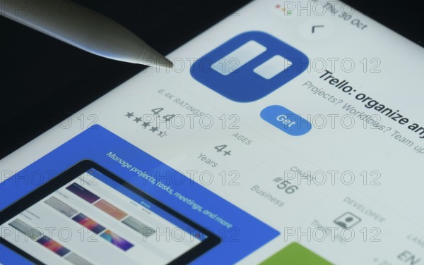 Dhaka, Bangladesh- 30 Oct 2025: Trello app on a iPad screen with a pen pointing at the install