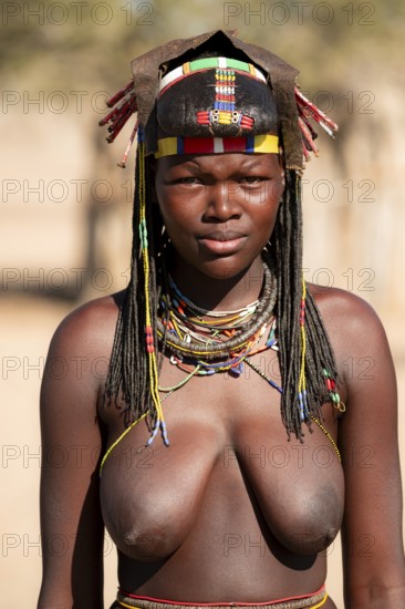 Portrait, brightly decorated woman of the Hakaona tribe, also Havakona or Hakawona, near Opuwo,