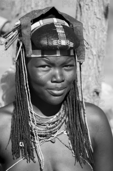 Black and white, portrait, brightly decorated woman of the Hakaona tribe, also Havakona or