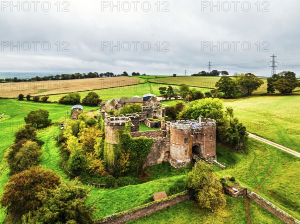 Autumn Colours over ruins of Pembridge Castle or Newland Castle from a drone, Herefordshire,