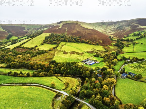 Autumn colours of Farms over River Wye and Road A470 from a drone, Llanidloes, Powys,