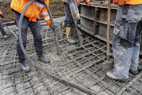Concreting, concreting the foundation of a wind turbine, concrete pump hose, compressor, more than