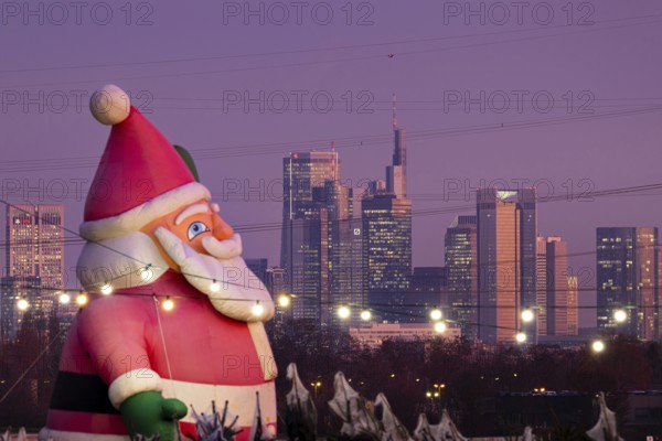 In a Christmas tree center near Frankfurt am Main, a multi-metre-high inflated figure of Santa