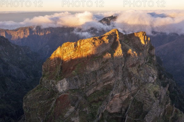 Aerial view, sunrise at Pico do Arieiro, clouds of fog sweeping over mountain peaks, Madeira,