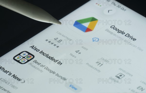 Dhaka, Bangladesh- 30 Oct 2025: Google Drive app on a iPad screen with a pen pointing at the