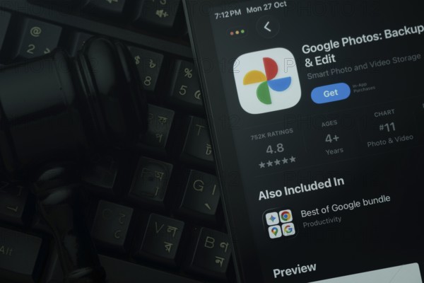 Dhaka, Bangladesh- 28 Oct 2025: An iPad displaying the Google Photos app against a judge's gavel