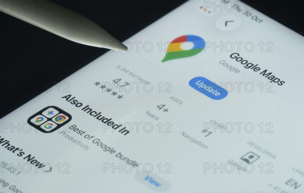 Dhaka, Bangladesh- 30 Oct 2025: Google maps app on a iPad screen with a pen pointing at the install