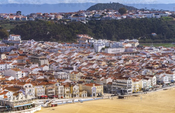 View from Leuct Tower towards orange tiled roofs in the town of Nazare, Estremadura, Portugal