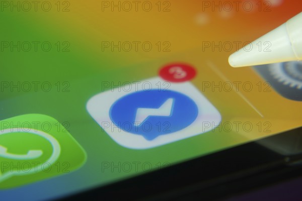 16 Nov 2025- Dhaka, Bangladesh: Stylus touching the Facebook Messenger app icon with a notification