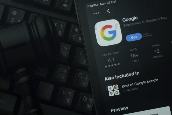 Dhaka, Bangladesh- 28 Oct 2025: An iPad displaying the Google app against a judge's gavel and dark