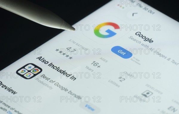 Dhaka, Bangladesh- 30 Oct 2025: Google app on a iPad screen with a pen pointing at the install