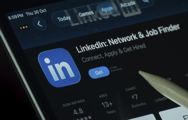 Dhaka, Bangladesh- 30 Oct 2025: LinkedIn app displayed on a iPad screen in dark mode with a digital