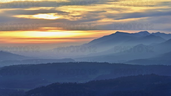 View of the Jura foothills from the Gisliflue, in the light of the setting sun, Talheim, Canton,