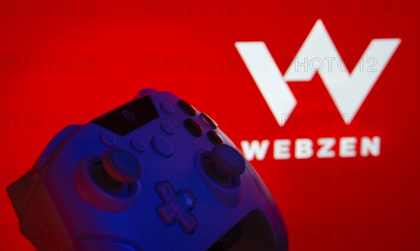 Dhaka, Bangladesh- 14 Nov 2025: A close-up of a gamepad with the Webzen seen on screen in the