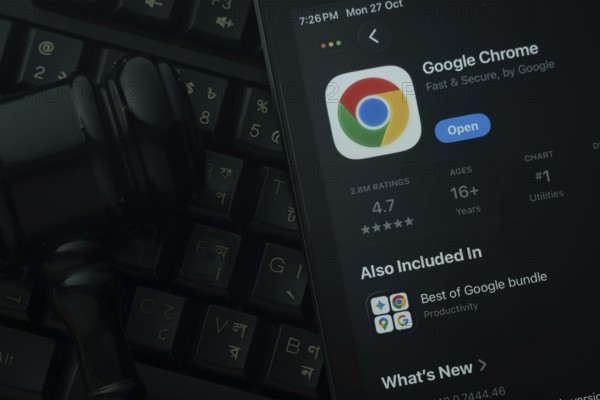 Dhaka, Bangladesh- 28 Oct 2025: An iPad displaying the Google Chrome app against a judge's gavel