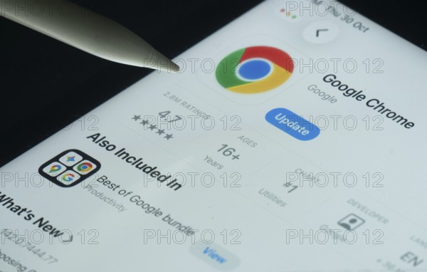 Dhaka, Bangladesh- 30 Oct 2025: Google Chrome app on a iPad screen with a pen pointing at the
