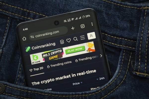 Dhaka, Bangladesh- 15 June 2025: A smartphone displaying the Coinranking web interface peeks out of