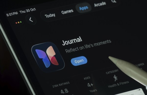 Dhaka, Bangladesh- 30 Oct 2025: Apple Journal app displayed on a iPad screen in dark mode with a