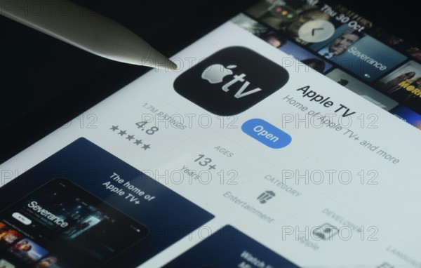 Dhaka, Bangladesh- 30 Oct 2025: Apple TV app on a iPad screen with a pen pointing at the install