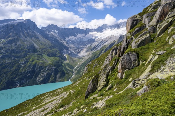 Turquoise blue mountain lake Göscheneralpsee, picturesque mountain landscape with dammastock and