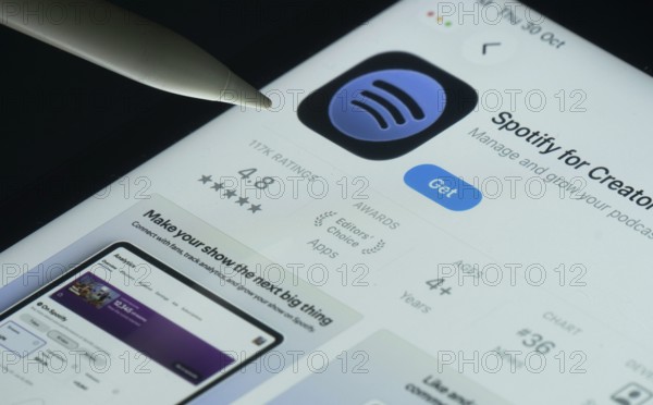 Dhaka, Bangladesh- 30 Oct 2025: Spotify for Creators app on a iPad screen with a pen pointing at