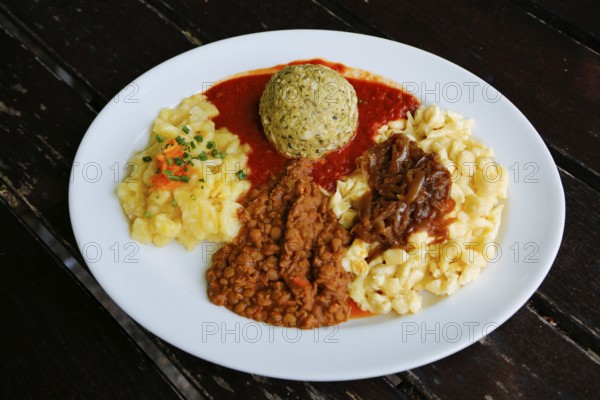 Swabian cuisine, potato salad with flavored onions, spätzle, knöpfle, dumplings with tomato sauce,