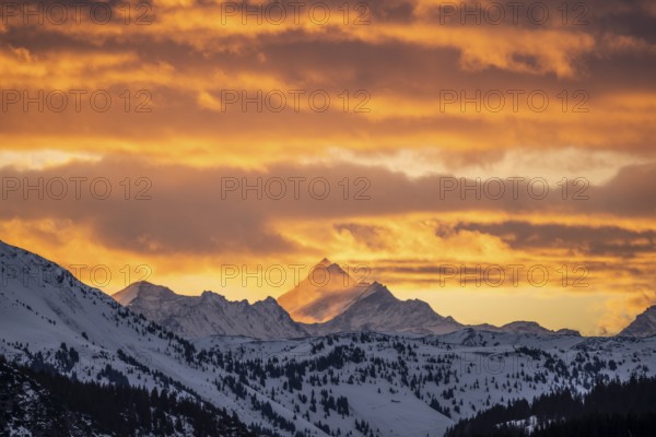 Grossglockner peaks at sunset in winter, spectacular cloudy skies, Hochbrixen, Brixen im Thale,