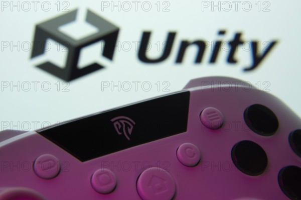 Dhaka, Bangladesh- 14 Nov 2025: A close-up of a gamepad with the Unity seen on screen in the
