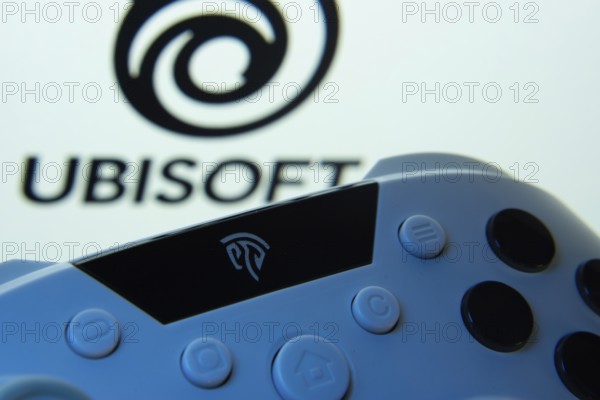 Dhaka, Bangladesh- 14 Nov 2025: A close-up of a gamepad with the Ubisoft seen on screen in the